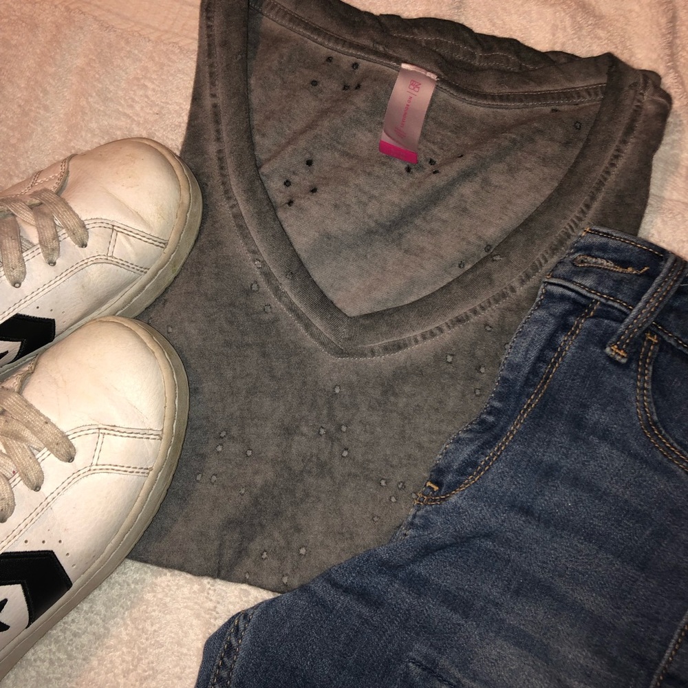 Short sleeve distressed gray shirt.